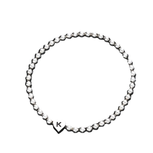 Minimalist silver beaded stretch bracelet featuring a heart charm with letter K engraving