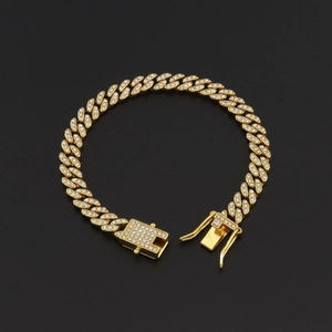 Close-up of gold iced-out 8mm Cuban link chain bracelet with diamond square buckle