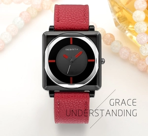 Detailed macro view of square quartz watch with red leather strap and black metal case