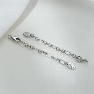 Detail of 14K gold filled rectangular tag and oval link extension chain with lobster clasp