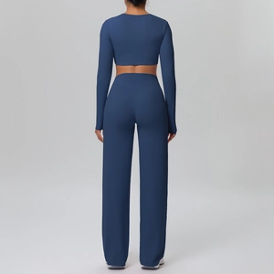 Rear view of navy blue long sleeve yoga top and high waist wide leg pants set