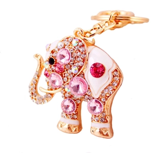 Exquisite gold elephant keychain with pink rhinestones and white enamel on white background