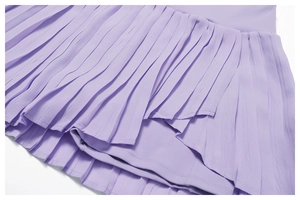 Detail view of lavender pleated tennis skirt showing moisture-wicking fabric and lining