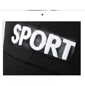 Detailed close-up of white SPORT embroidery on a premium black canvas baseball cap