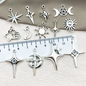 Set of 12 silver DIY alloy pendants with star, moon, and sun themes for jewelry making