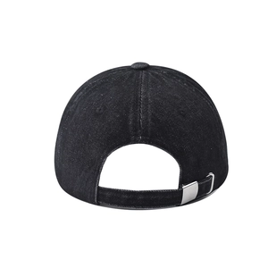 Detail of washed denim baseball cap with adjustable silver metal buckle on the back