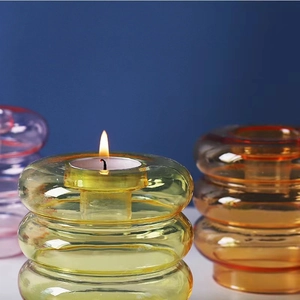 Modern tiered yellow glass candle holder and flower vase set for minimalist home decor