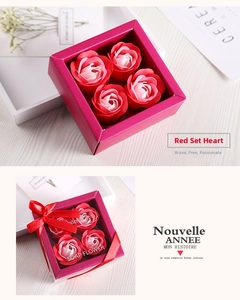 Close-up of a square rose soap flower gift box with red gradient petals and a silk ribbon