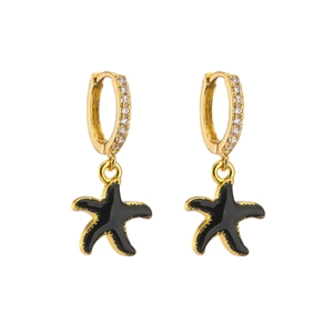 Close-up of gold starfish drop earrings with black enamel and micro-set zircon accents