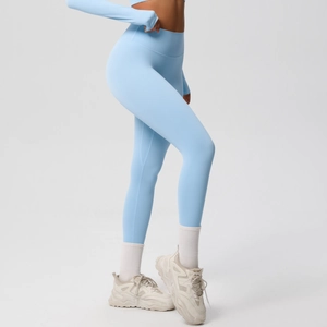 Detail of high-waist light blue seamless yoga set with elastic shaping leggings and top