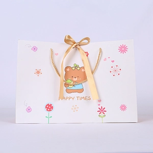 Cartoon bear paper gift bag with gold ribbon bow and handle for candy packaging