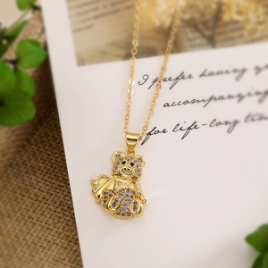 18K gold plated necklace with purple zircon bear pendant on a handwritten note card