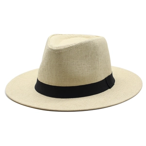 Detailed view of the breathable straw weave and decorative black ribbon on this Panama hat