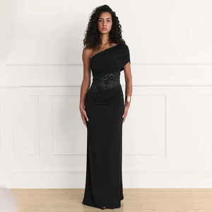 Detail view of the black one-shoulder maxi dress featuring elegant waist lace patchwork