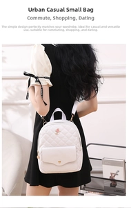 Detail view of the white quilted leather backpack with elegant rose flower embroidery