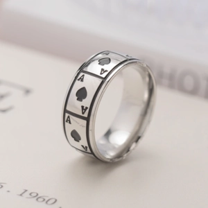 Detailed macro view showing the Ace of Spades pattern on a polished titanium steel ring