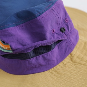 Nylon outdoor sun hat with blue-purple contrast panels and breathable mesh detail