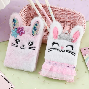 Cute bunny plush notebooks in pink and white with crown detail in a pink basket