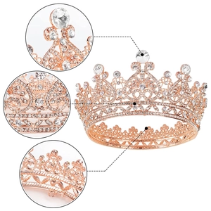 Detail view of rose gold bridal crown featuring intricate heart patterns and crystal stones