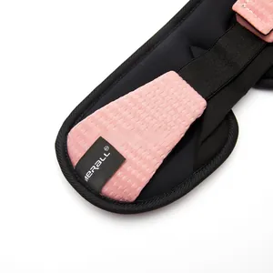 Macro shot of breathable pink mesh fabric with black elastic strap and sewn brand label