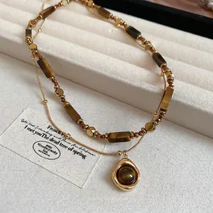 Double-layered gold-plated tiger eye stone necklace set with elegant pendant for women
