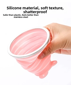 Detail of pink collapsible food-grade silicone travel cup showing soft flexible material