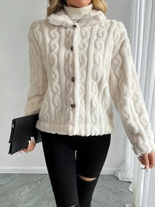 White faux fur cardigan featuring thick cable knit texture and dark contrast buttons