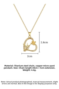 Detailed view of hummingbird heart pendant with micro-set stones and chain dimensions