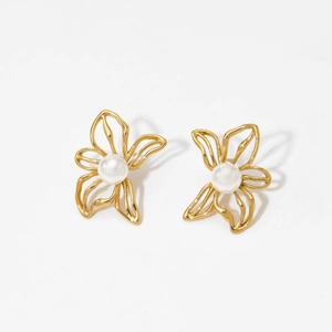 Elegant gold hollow flower stud earrings with white pearl centers on white background