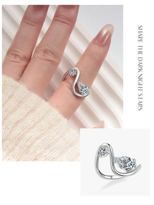 Macro shot of S925 sterling silver ring featuring a curved line design and white zircon