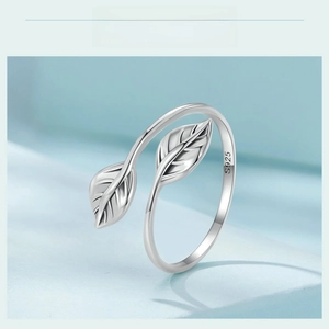 Macro shot of S925 sterling silver ring showing detailed double leaf design and smooth finish