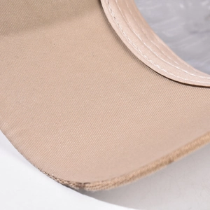 Close-up of beige plaid baseball cap showing premium fabric texture and double stitching