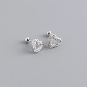 Detailed macro of S925 silver hollow heart earrings with shimmering zircon pavé stones