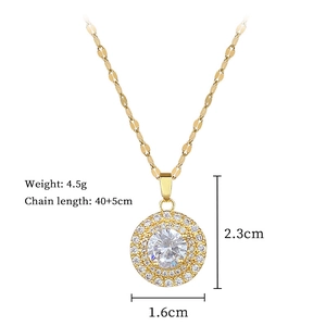 Macro shot of gold crystal pendant showing 2.3cm height and 1.6cm width dimensions