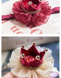 Detailed view of child princess crown hair clips in burgundy satin and champagne gold organza