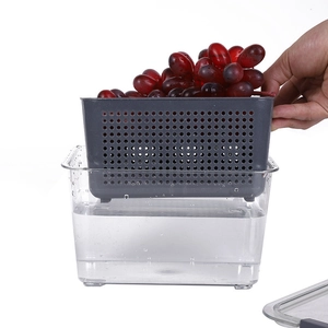 Dual-layer Japanese food storage box with gray strainer basket and clear container