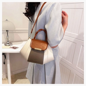 Detailed side view of a tricolor PU leather crossbody bag with metal buckle and shoulder strap