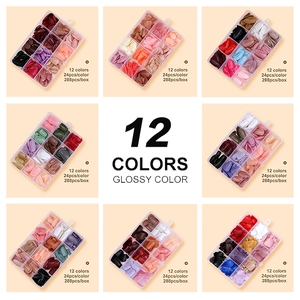 Set of 288 glossy solid color press-on nails in 12 vibrant shades for manicure styling