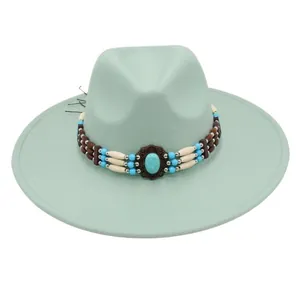 Detailed view of mint green fedora hat featuring ethnic turquoise beaded hatband