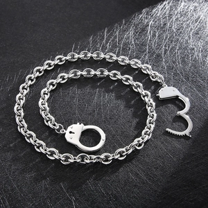 Macro view of stainless steel handcuffs chain links with polished silver metal finish