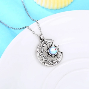 Celestial sun and moon pendant necklace with opal gemstone and Celtic knot patterns