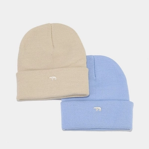 Detail of bear embroidery on beige and blue thick knitted winter beanie hats