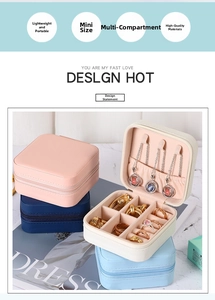 Detail view of mini travel jewelry box with multiple compartments and ring storage slots