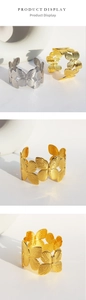 Detailed close-up of butterfly hollow-out wide open bangles in gold and silver finishes