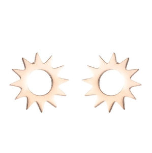 Detail of rose gold sunburst stud earrings with cutout center in minimalist metal design
