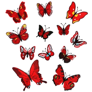 Detailed embroidery texture of 12 red butterfly iron-on patches in various sizes