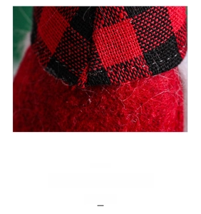 Close-up of red and black buffalo plaid knitted fabric on a Christmas gnome decoration
