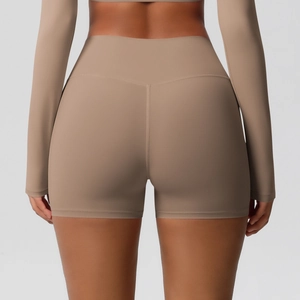 Detail view of khaki high-waisted yoga shorts with scrunch butt seam for contouring