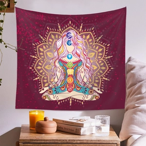 Detailed view of a chakra meditation tapestry with a mandala pattern on a bedroom wall