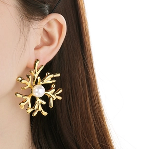 Chic 18K gold plated coral branch pearl earrings showcased on a model's ear